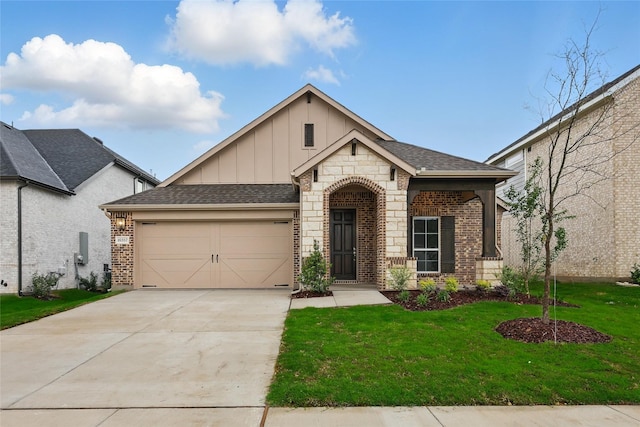 view of front of property featuring brick siding, concrete driveway, a garage, a front yard, and board and batten siding