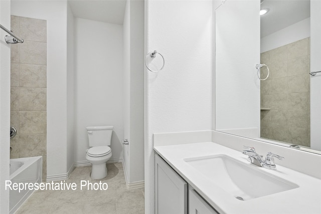 bathroom featuring bathtub / shower combination, toilet, vanity, tile patterned flooring, and baseboards