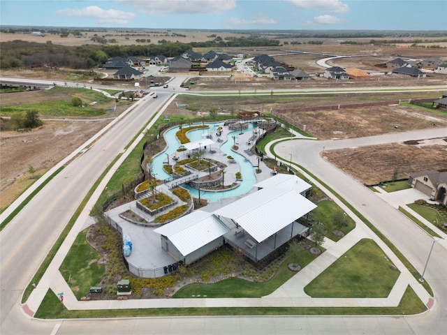 birds eye view of property with a residential view