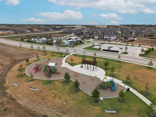 birds eye view of property with a residential view