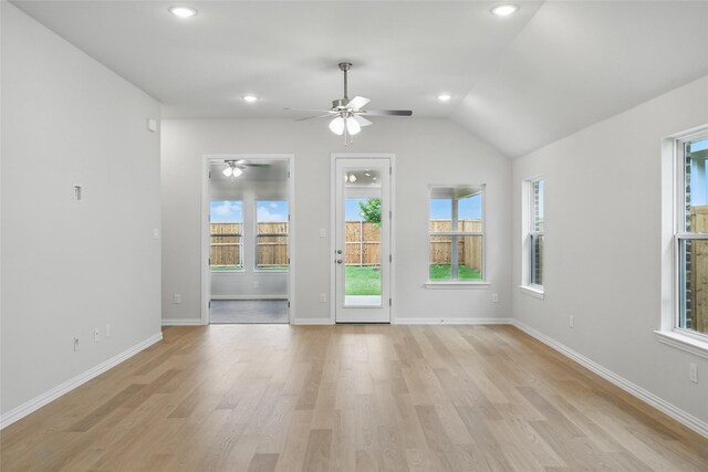 interior space with light wood-style flooring, baseboards, a ceiling fan, and recessed lighting