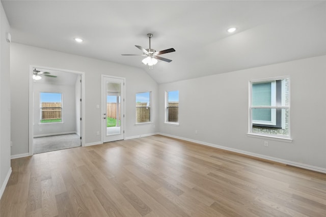 interior space featuring a healthy amount of sunlight, light wood-style flooring, baseboards, and ceiling fan