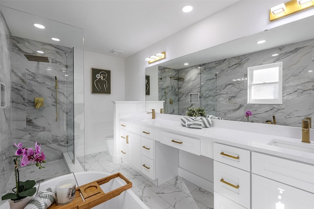 bathroom with marble finish floor, a marble finish shower, double vanity, recessed lighting, and a sink