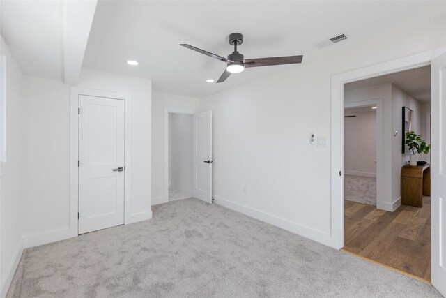 unfurnished bedroom with recessed lighting, carpet floors, a ceiling fan, visible vents, and baseboards