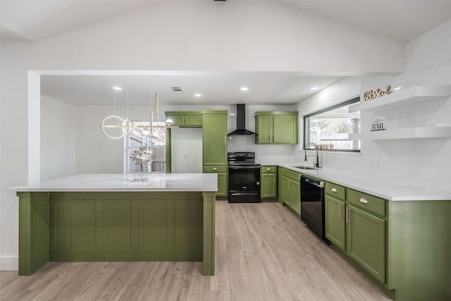 kitchen featuring green cabinets, wall chimney range hood, black appliances, open shelves, and a sink