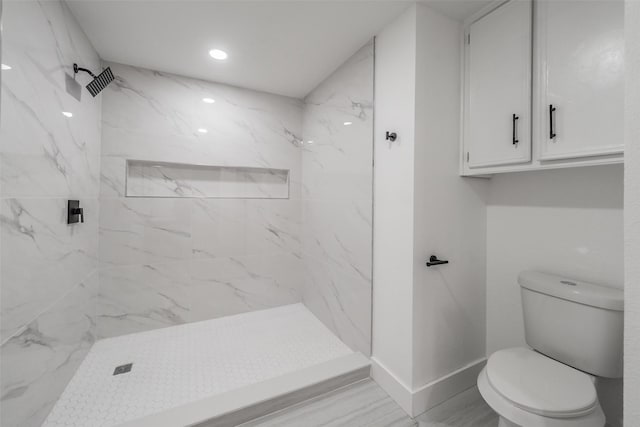 bathroom with recessed lighting, a marble finish shower, toilet, and baseboards