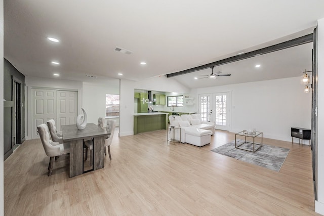 dining space featuring french doors, vaulted ceiling with beams, recessed lighting, visible vents, and light wood-style flooring