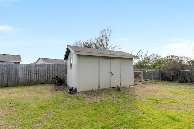 view of shed with a fenced backyard