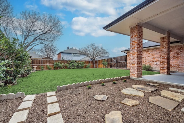 view of yard with a fenced backyard and a patio area