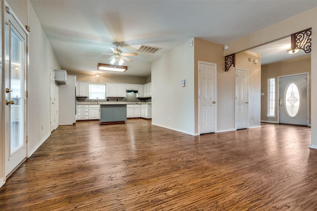 kitchen featuring ceiling fan, visible vents, white cabinets, open floor plan, and dark wood-style floors