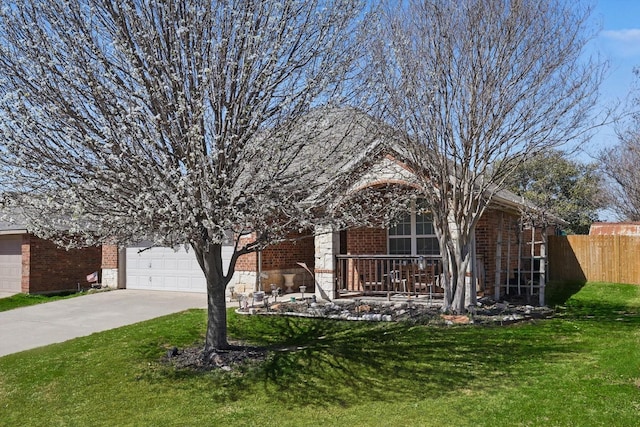 single story home with a front yard, fence, driveway, a porch, and brick siding