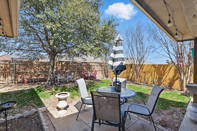 view of patio / terrace featuring a fenced backyard and outdoor dining space