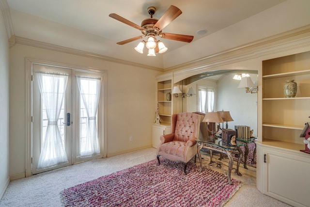 living area featuring light colored carpet, arched walkways, french doors, and a healthy amount of sunlight