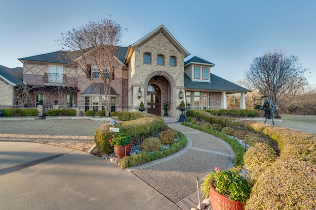 view of front of house featuring stone siding and brick siding