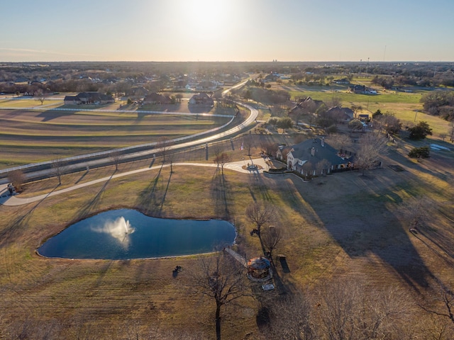 birds eye view of property with a water view and a rural view