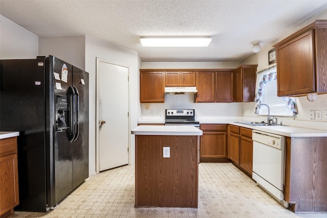 kitchen with dishwasher, light floors, black fridge, and stainless steel range with electric cooktop