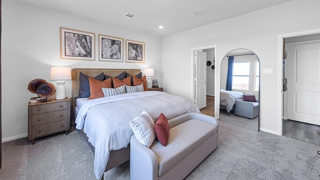 bedroom with baseboards, visible vents, carpet flooring, and recessed lighting