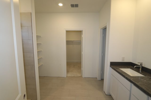 bathroom featuring recessed lighting, visible vents, and vanity