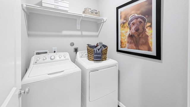 laundry area with washing machine and dryer and laundry area