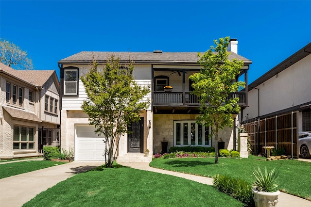 view of front facade featuring concrete driveway, a balcony, a chimney, an attached garage, and a front lawn