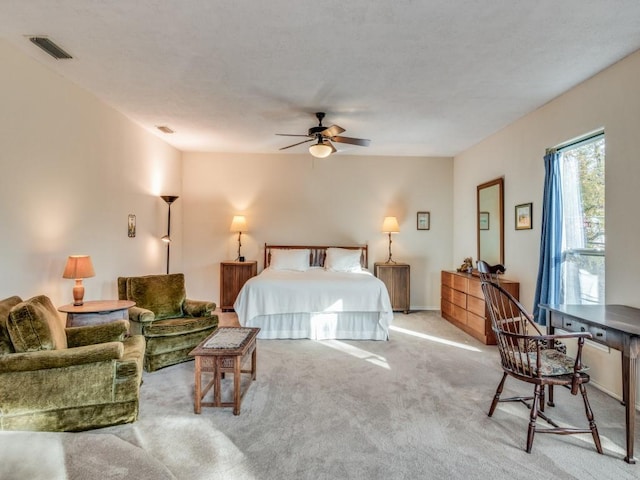 bedroom featuring carpet, visible vents, and a ceiling fan