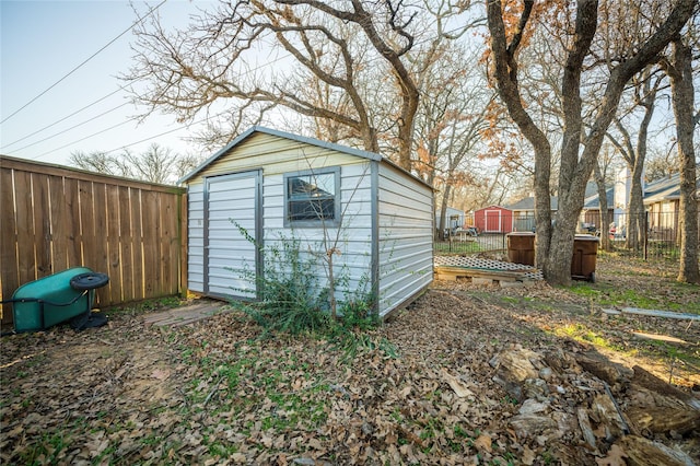 view of shed featuring a fenced backyard