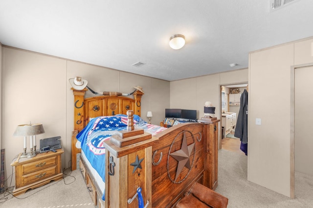 bedroom with light colored carpet and visible vents