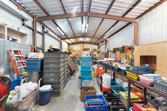 garage featuring a workshop area and metal wall