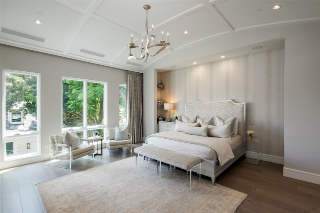 bedroom featuring coffered ceiling, hardwood / wood-style floors, and multiple windows