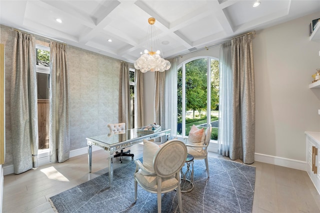 office with coffered ceiling, a notable chandelier, plenty of natural light, and baseboards