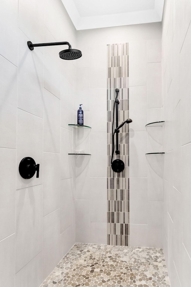 bathroom with a tile shower