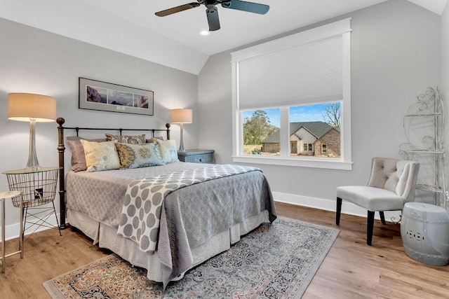 bedroom featuring recessed lighting, a ceiling fan, baseboards, vaulted ceiling, and light wood-style floors