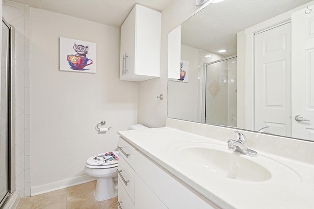 full bathroom with tile patterned floors, toilet, a stall shower, and vanity