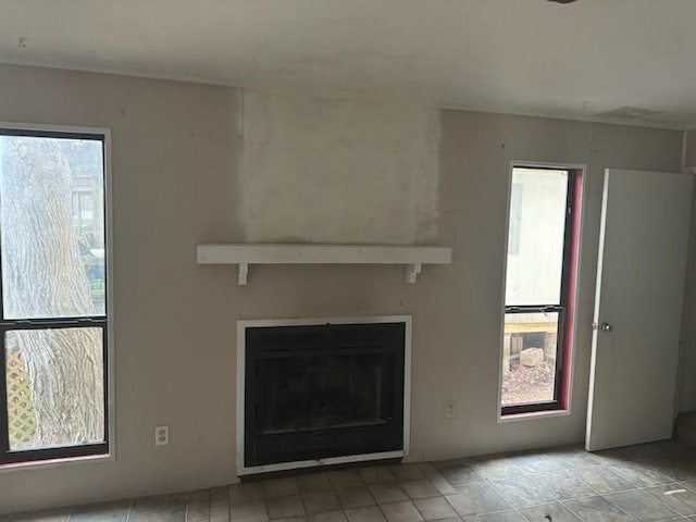 unfurnished living room with a fireplace