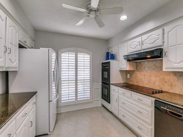 kitchen featuring light tile patterned floors, under cabinet range hood, white cabinetry, backsplash, and black appliances