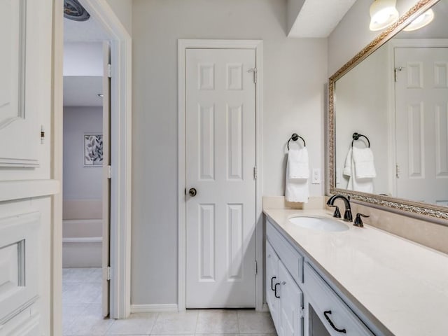 bathroom with tile patterned flooring and vanity