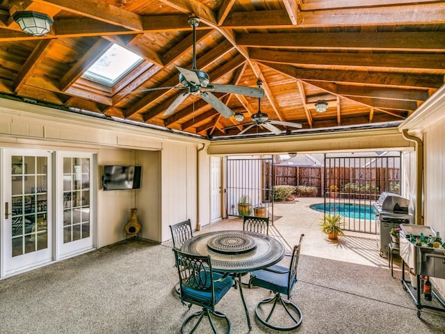 view of patio featuring area for grilling, fence, a ceiling fan, a gazebo, and a fenced in pool