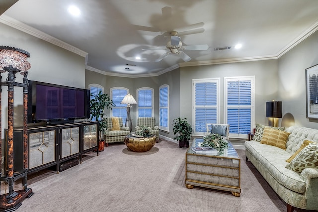 carpeted living room with ceiling fan, ornamental molding, visible vents, and baseboards