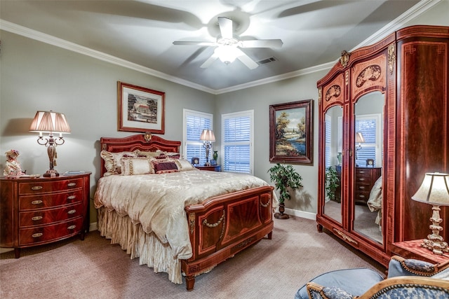 carpeted bedroom with baseboards, visible vents, ceiling fan, and crown molding