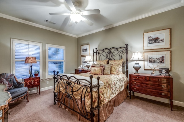 bedroom with baseboards, visible vents, a ceiling fan, carpet, and crown molding