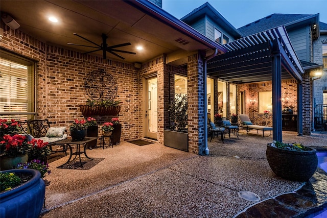 view of patio featuring visible vents, ceiling fan, and a pergola