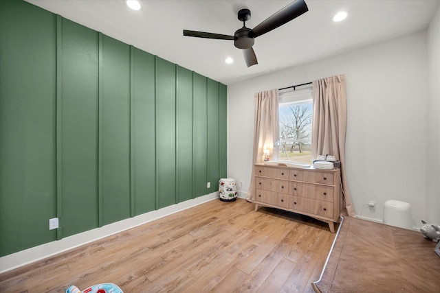 bedroom featuring light wood-style flooring, a ceiling fan, and recessed lighting