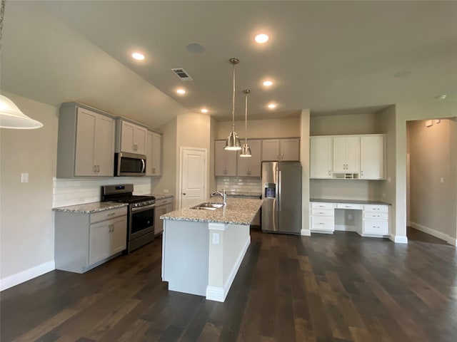 kitchen featuring stainless steel appliances, gray cabinets, visible vents, and a sink