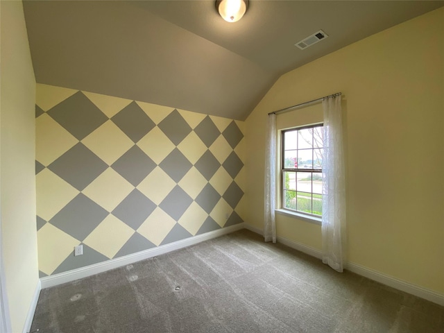 bonus room with lofted ceiling, carpet flooring, visible vents, and baseboards