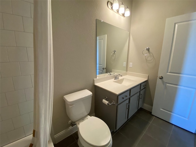 full bathroom with baseboards, vanity, toilet, and tile patterned floors