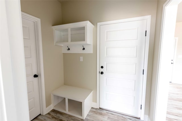 mudroom featuring light wood-type flooring and baseboards