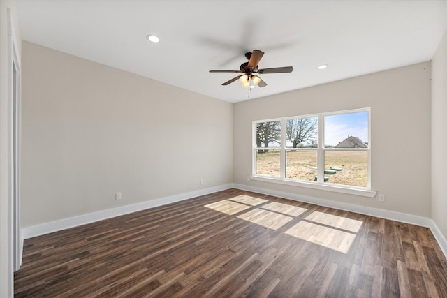 unfurnished room with dark wood-style floors, ceiling fan, recessed lighting, and baseboards