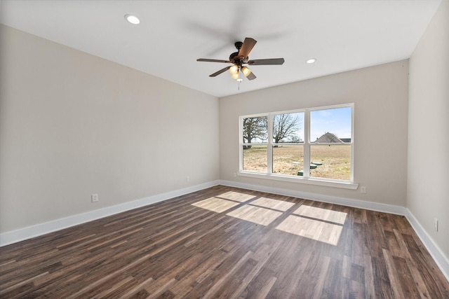 unfurnished room with recessed lighting, wood finished floors, a ceiling fan, and baseboards