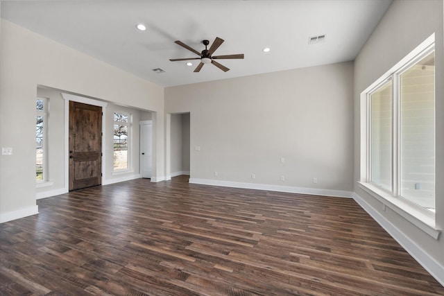 interior space featuring recessed lighting, dark wood-style flooring, visible vents, and baseboards