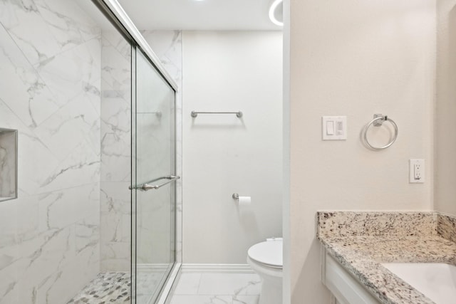 bathroom with marble finish floor, toilet, and a marble finish shower